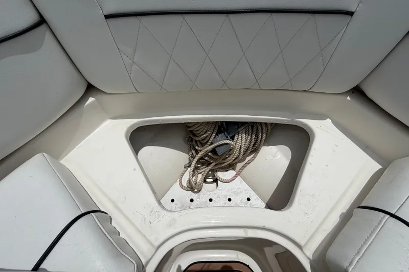Slide: The Image of Interior of 2007 Sea Ray SLX 250 boat with rope storage compartment. - 50