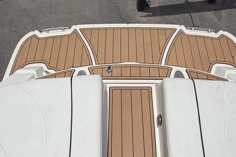 Slide: The Image of 2007 Sea Ray SLX 250 boat deck with teak flooring, viewed from above. - 80