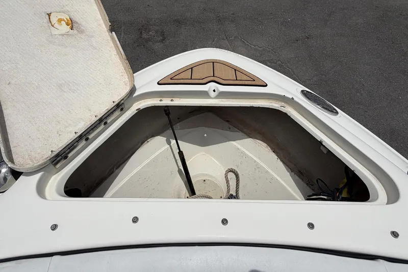 Slide: The Image of Open storage compartment of a 2007 Sea Ray SLX 250 boat. - 43