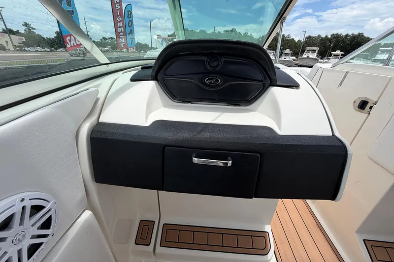 Slide: The Image of 2007 Sea Ray SLX 250 dashboard with sleek design and modern controls. - 58