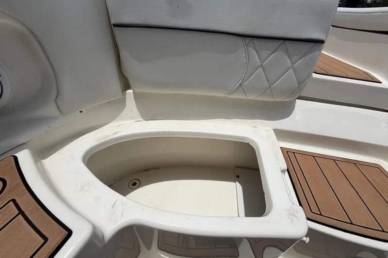 Slide: The Image of 2007 Sea Ray SLX 250 boat interior with white seating and wood accents. - 72