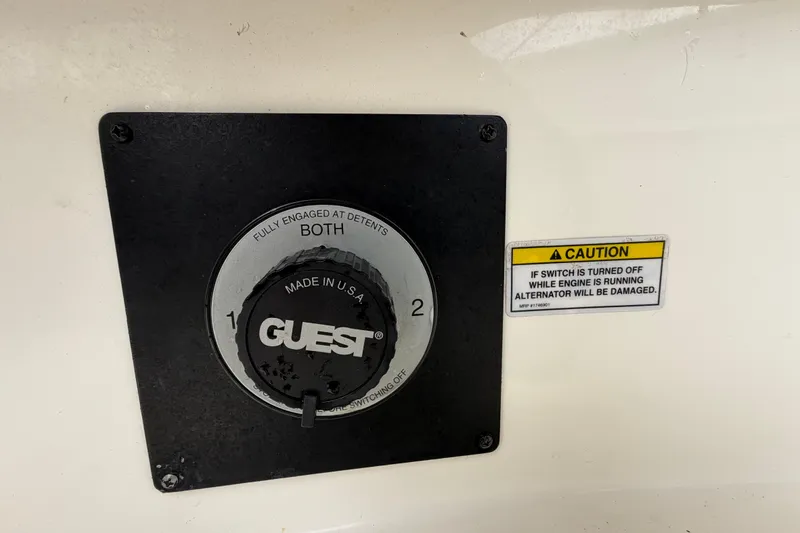 Slide: The Image of Battery switch panel on a 2007 Sea Ray SLX 250 boat with caution label. - 69