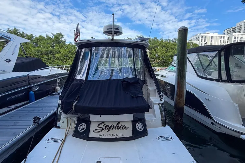 Slide: The Image of 2015 Regal 38 Express yacht docked in Aventura, Florida marina. - 13