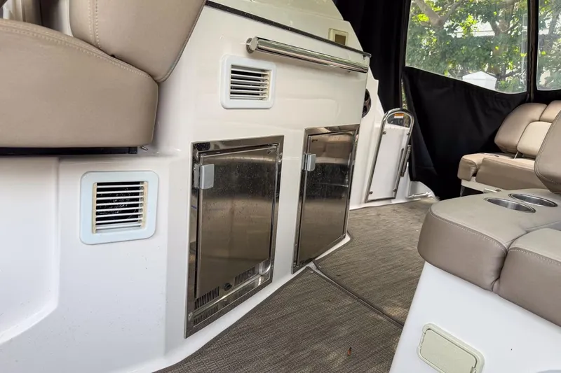 Slide: The Image of Interior of 2015 Regal 38 Express yacht with beige seating and stainless steel fixtures. - 73