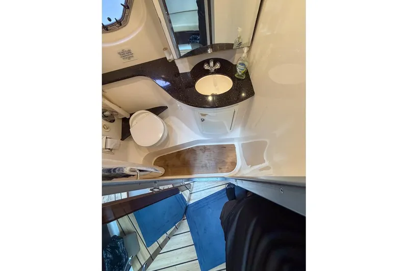 Slide: The Image of Bathroom interior of 2015 Regal 38 Express yacht with sink and toilet. - 91