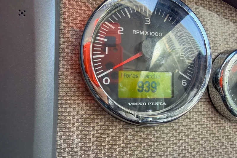 Slide: The Image of Volvo Penta RPM gauge showing 939 hours on a 2015 Regal 38 Express. - 57