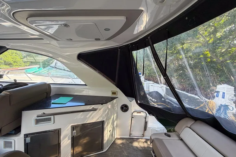 Slide: The Image of Interior view of 2015 Regal 38 Express yacht with seating and windows. - 70