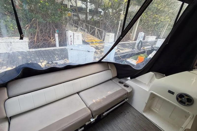 Slide: The Image of Interior view of 2015 Regal 38 Express boat with seating and dockside view. - 51