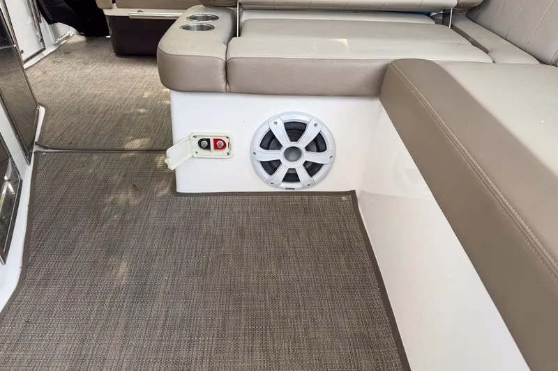 Slide: The Image of Interior of 2015 Regal 38 Express boat with speaker and seating area. - 75