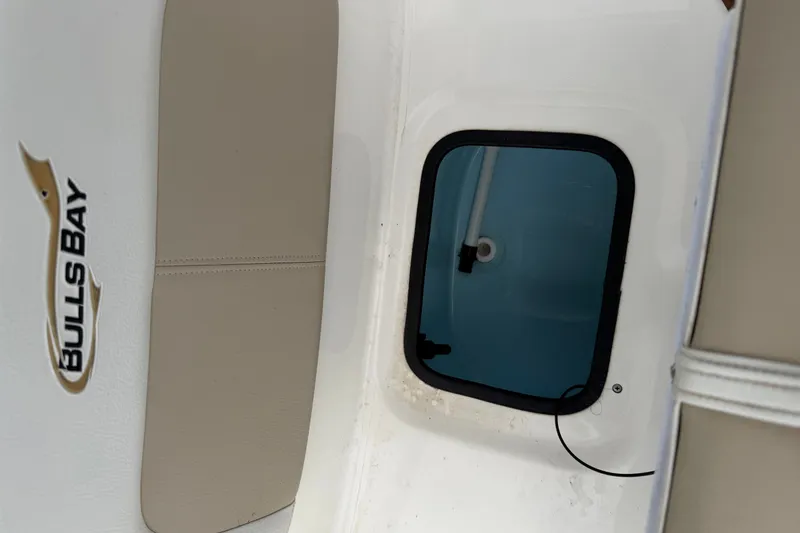 Slide: The Image of Bulls Bay 2200 XS boat interior detail, featuring a storage compartment, 2025 model. - 25