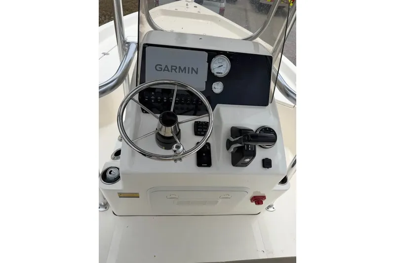 Slide: The Image of 2025 Bulls Bay 2200 XS boat console with Garmin navigation system and steering wheel. - 16