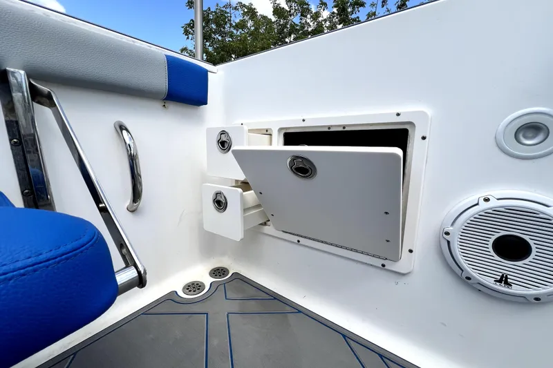 Slide: The Image of 2007 Wellcraft 35 Scarab Sport Open boat interior with storage compartments and speaker. - 74