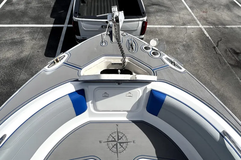 Slide: The Image of 2007 Wellcraft 35 Scarab Sport Open boat parked, showing bow seating and anchor. - 111