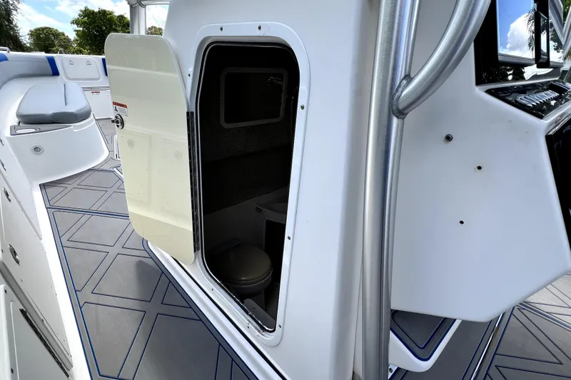 Slide: The Image of 2007 Wellcraft 35 Scarab Sport Open boat interior with open cabin door. - 69