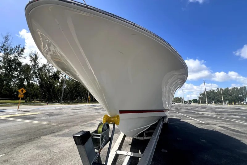 Slide: The Image of 2007 Wellcraft 35 Scarab Sport Open boat on trailer under blue sky. - 22