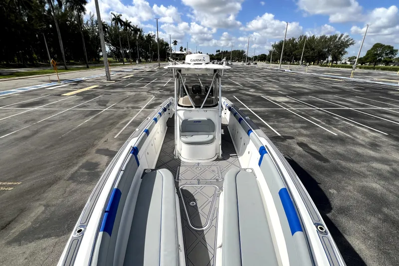 Slide: The Image of 2007 Wellcraft 35 Scarab Sport Open boat in empty parking lot under blue sky. - 99