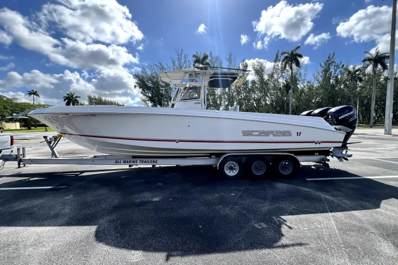 Slide: The Image of 2007 Wellcraft 35 Scarab Sport Open boat on trailer under blue sky. - 17