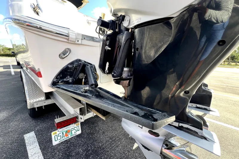 Slide: The Image of 2007 Wellcraft 35 Scarab Sport Open boat on trailer, close-up of outboard motor and hull. - 15