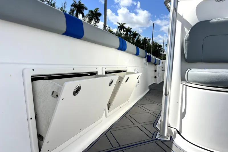 Slide: The Image of 2007 Wellcraft 35 Scarab Sport Open boat interior with storage compartments and seating. - 90