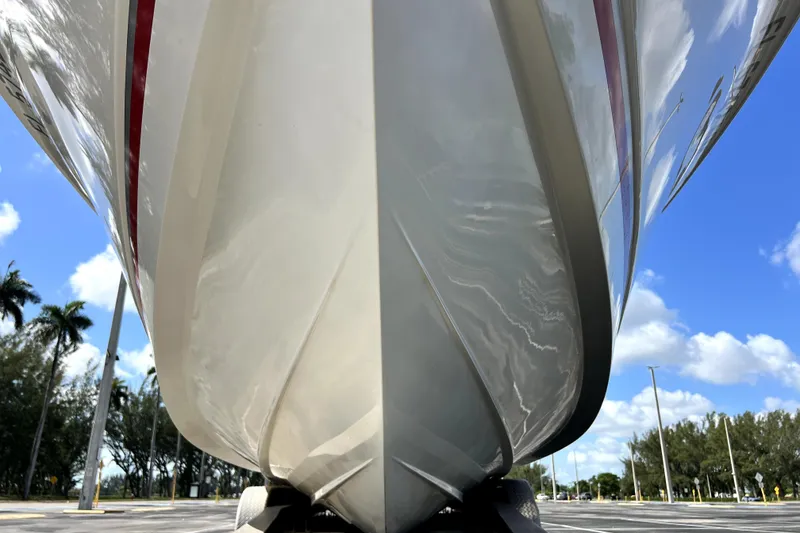 Slide: The Image of 2007 Wellcraft 35 Scarab Sport Open boat hull, viewed from below, against a clear blue sky. - 20