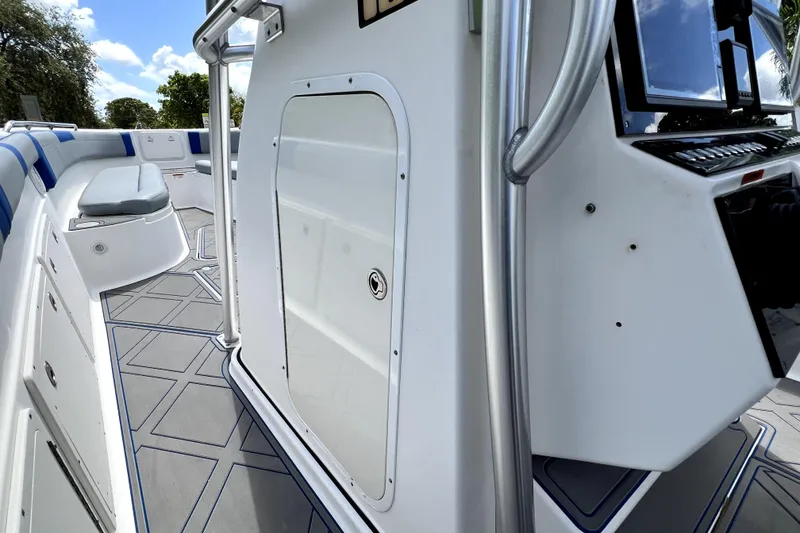Slide: The Image of 2007 Wellcraft 35 Scarab Sport Open boat interior with seating and control panel. - 68