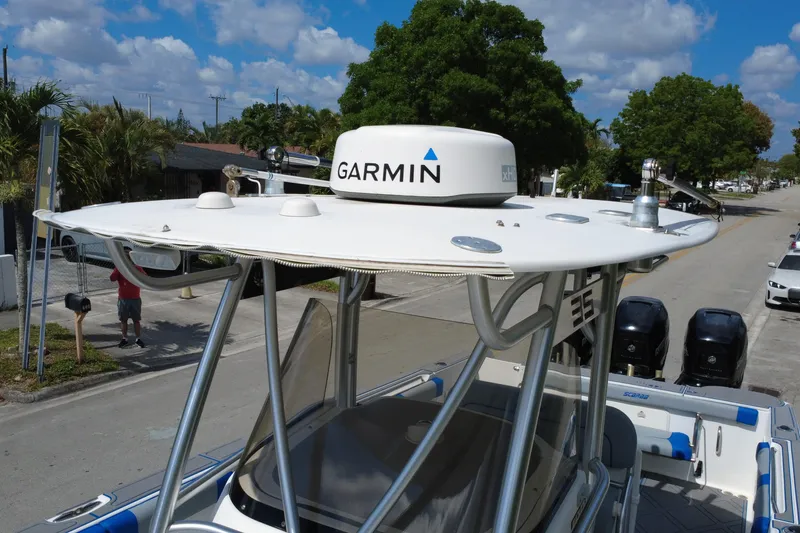 Slide: The Image of 2007 Wellcraft 35 Scarab Sport Open with Garmin radar, parked on a sunny street. - 115