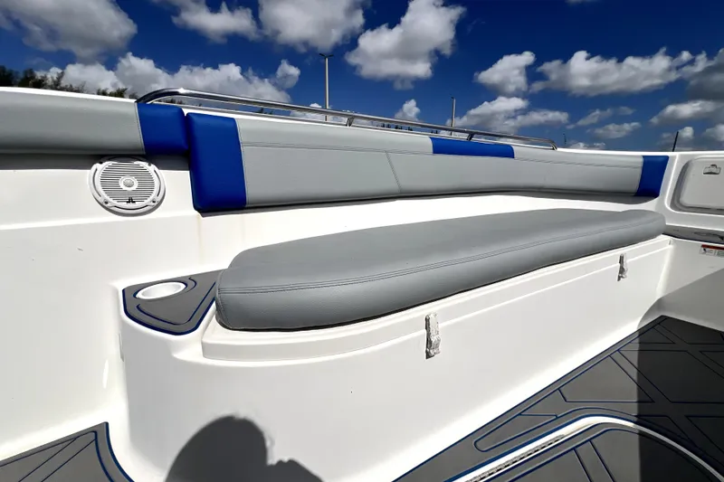 Slide: The Image of 2007 Wellcraft 35 Scarab Sport Open boat interior with cushioned seating under a blue sky. - 106