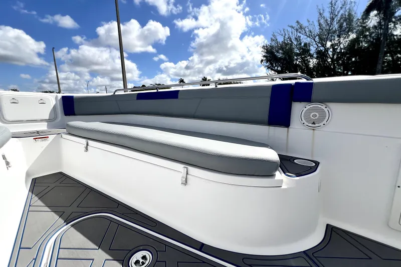 Slide: The Image of 2007 Wellcraft 35 Scarab Sport Open boat interior with cushioned seating and speaker. - 105