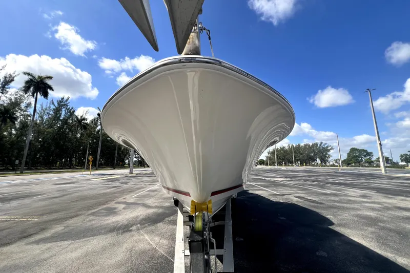 Slide: The Image of 2007 Wellcraft 35 Scarab Sport Open boat on trailer under blue sky. - 21