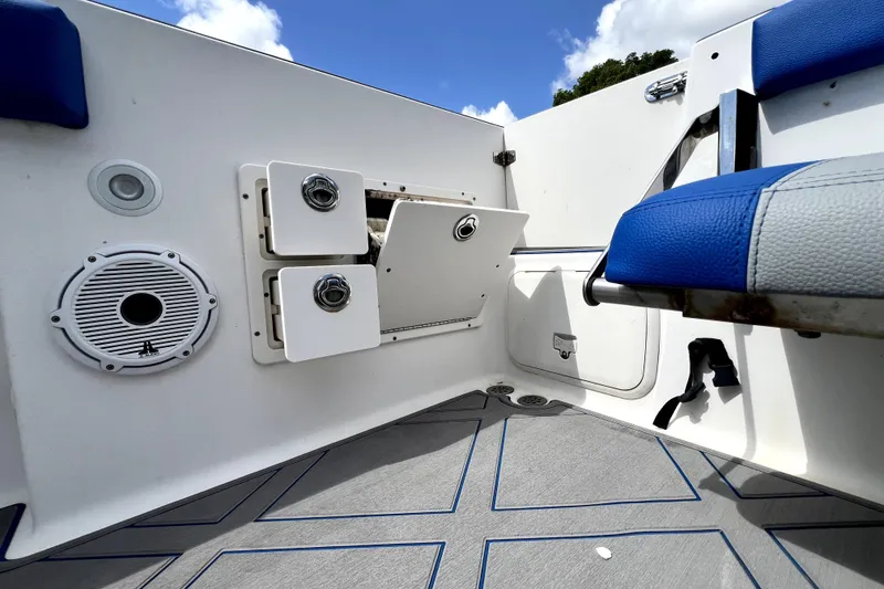 Slide: The Image of 2007 Wellcraft 35 Scarab Sport Open boat interior with storage compartments and speaker. - 80