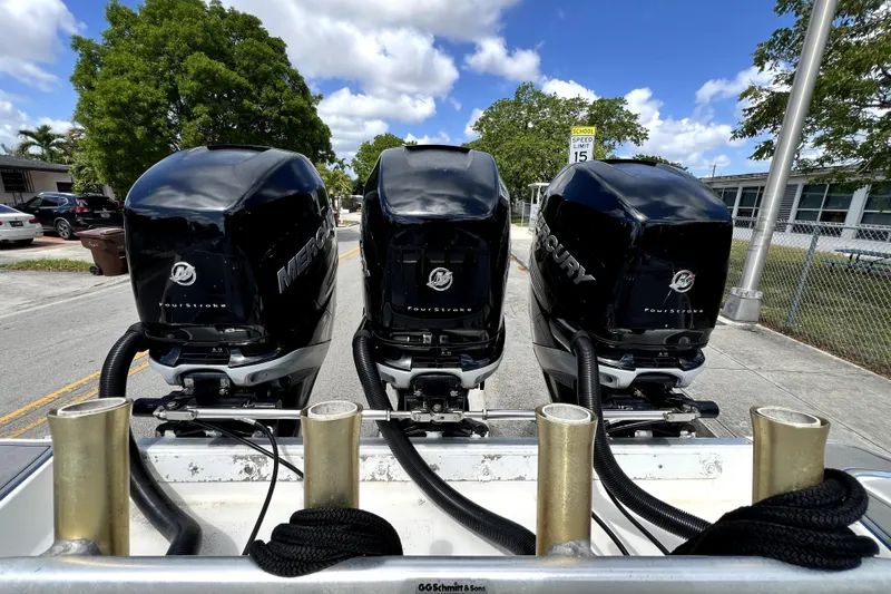 Slide: The Image of Triple Mercury outboard engines on a 2007 Wellcraft 35 Scarab Sport Open boat. - 65