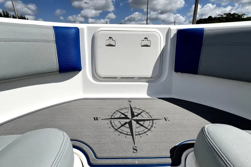 Slide: The Image of 2007 Wellcraft 35 Scarab Sport Open boat interior with compass design flooring. - 102