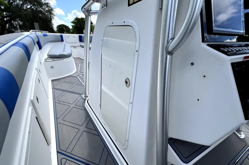 Slide: The Image of 2007 Wellcraft 35 Scarab Sport Open boat interior with blue seating and modern console. - 71