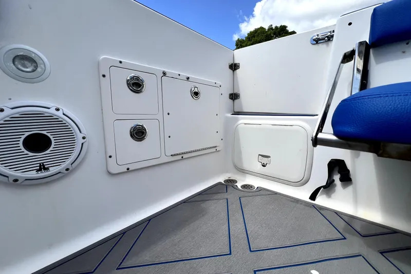 Slide: The Image of Interior view of a 2007 Wellcraft 35 Scarab Sport Open boat, featuring storage compartments and seating. - 94