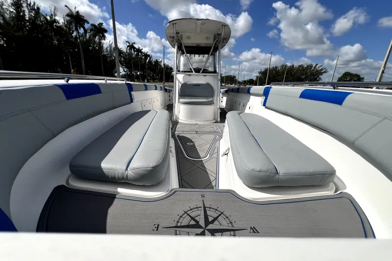 Slide: The Image of 2007 Wellcraft 35 Scarab Sport Open boat interior with cushioned seating and compass design. - 108