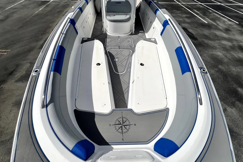 Slide: The Image of 2007 Wellcraft 35 Scarab Sport Open boat interior with blue and white seating. - 97