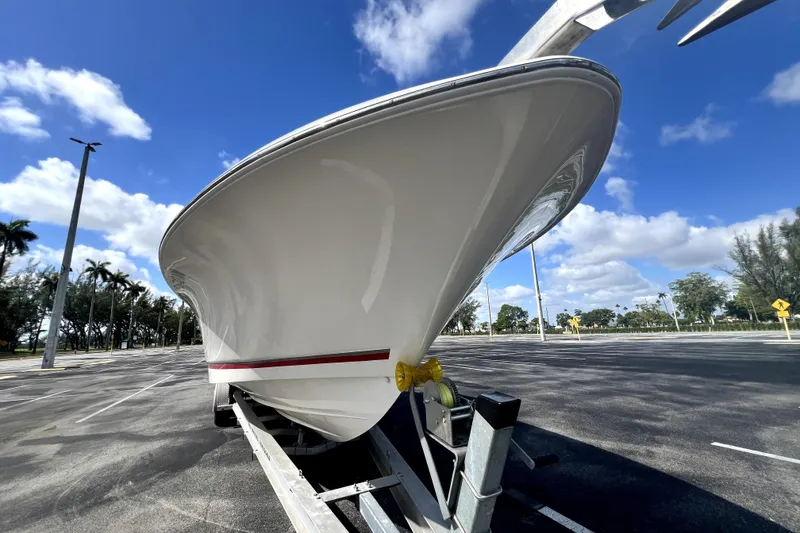 Slide: The Image of 2007 Wellcraft 35 Scarab Sport Open boat on trailer under blue sky. - 23