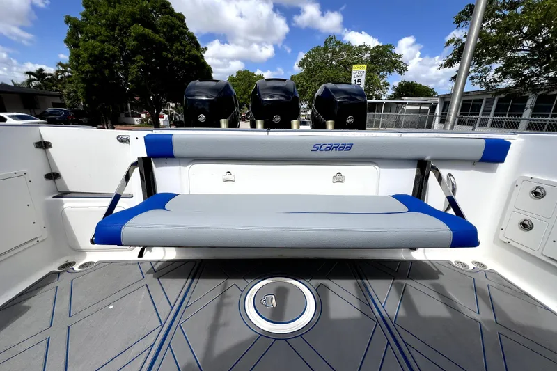 Slide: The Image of 2007 Wellcraft 35 Scarab Sport Open boat interior with seating and triple outboard motors. - 66