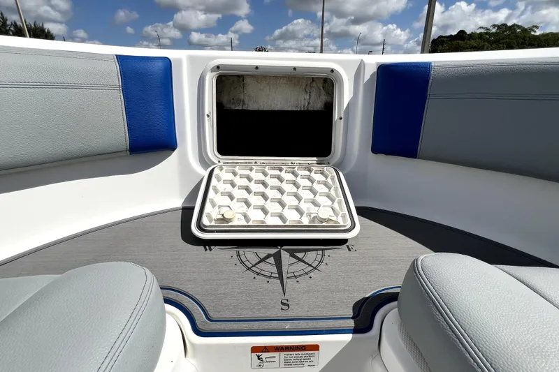 Slide: The Image of 2007 Wellcraft 35 Scarab Sport Open boat interior with open hatch and compass design. - 103