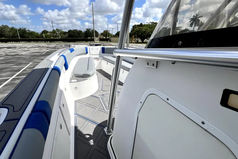 Slide: The Image of 2007 Wellcraft 35 Scarab Sport Open boat interior with blue seating and sleek design. - 84