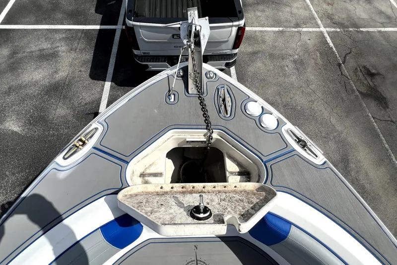 Slide: The Image of 2007 Wellcraft 35 Scarab Sport Open boat on trailer, parked in lot. - 101