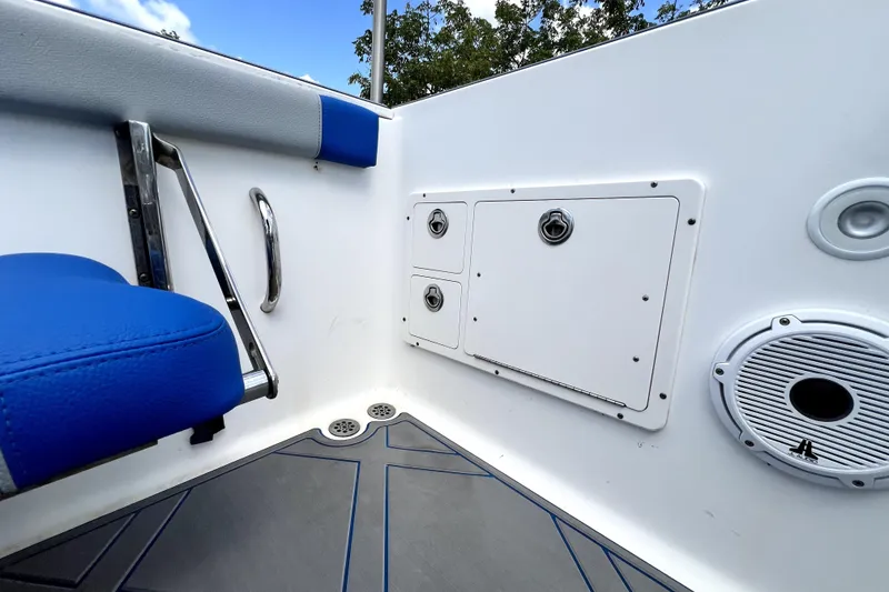Slide: The Image of 2007 Wellcraft 35 Scarab Sport Open boat interior with blue seating and storage compartments. - 73