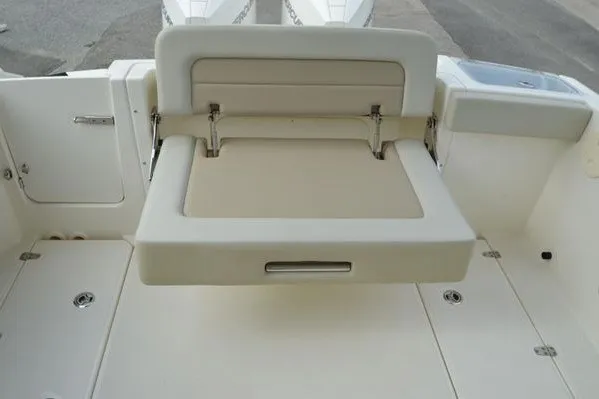 Slide: The Image of 2022 Boston Whaler 280 Vantage boat with foldable seating on deck. - 38