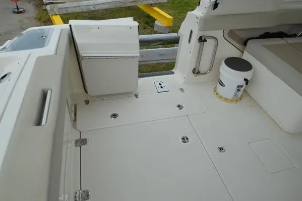 Slide: The Image of 2022 Boston Whaler 280 Vantage boat deck with seating and storage features. - 42
