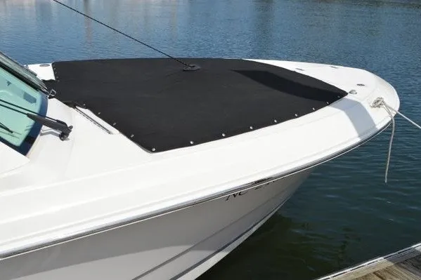 Slide: The Image of 2022 Boston Whaler 280 Vantage boat with black cover on water. - 15