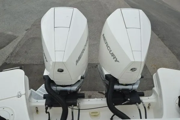 Slide: The Image of Twin Mercury outboard engines on a 2022 Boston Whaler 280 Vantage boat. - 44