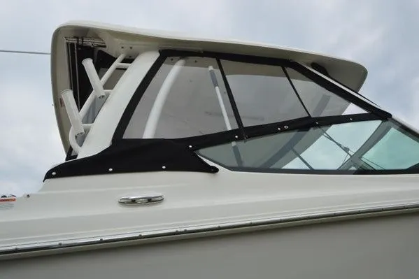 Slide: The Image of 2022 Boston Whaler 280 Vantage boat with sleek design and protective canopy. - 18