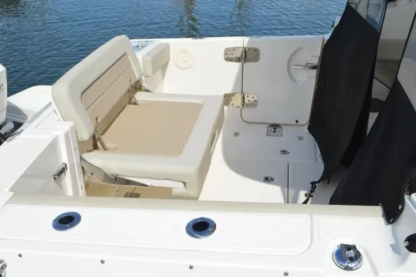 Slide: The Image of 2022 Boston Whaler 280 Vantage boat interior with seating and deck details. - 9