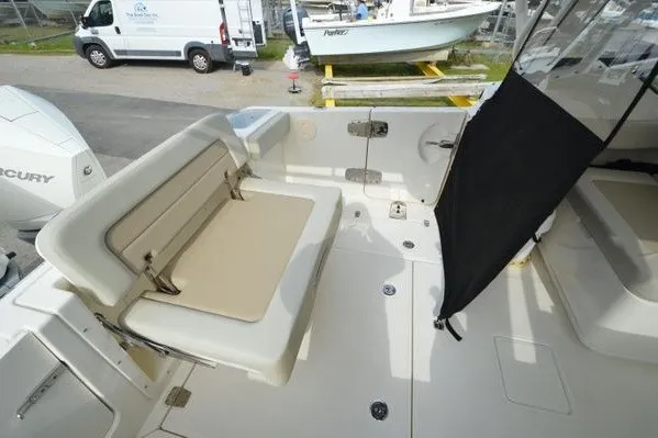 Slide: The Image of 2022 Boston Whaler 280 Vantage boat interior with seating and deck view. - 35