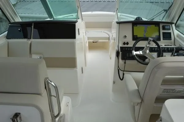 Slide: The Image of 2022 Boston Whaler 280 Vantage boat interior with modern helm and seating. - 33